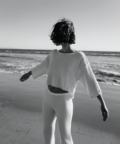 REVÉS sweater.                       The architecture of knit: a geometric silhouette woven in the purity of silk