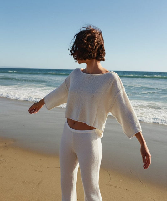 REVÉS sweater.                       The architecture of knit: a geometric silhouette woven in the purity of silk